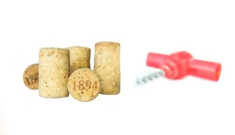 Corkscrew and wine corks close-up Stock Photos