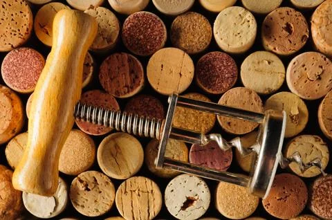 Corkscrew and wine corks Stock Photos