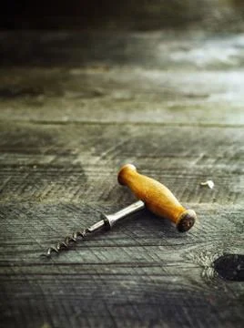 Corkscrew on a wooden table background Stock Photos