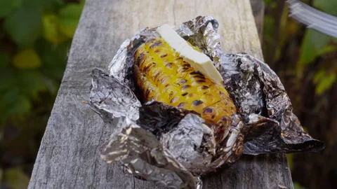 Corn baked in foil on the grill. Sliding forward. Close-up Stock-Footage 141082263