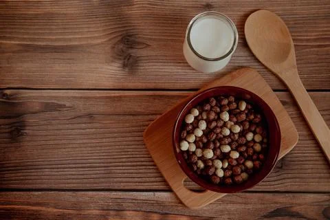 Corn balls for breakfast with milk on a wooden background Stock Photos