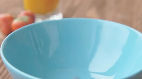 Corn balls pour in a bowl Stock Footage 68949271