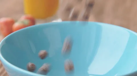 Corn balls pour in a bowl Stock Footage 68949512