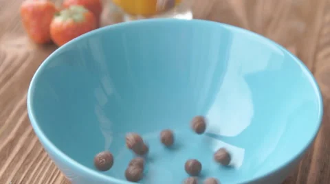 Corn balls pour in a bowl Stock Footage 68950289