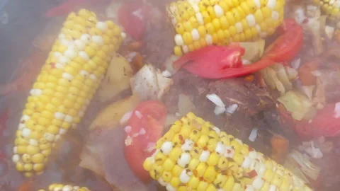 Corn with beef and vegetables. Soup with Tomato, red pepper cooked on hot coals Stock Footage 218646150