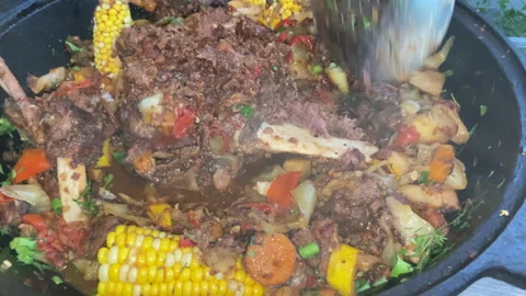 Corn with beef and vegetables. Soup with Tomato, red pepper cooked on hot coals Stock Footage 218646973