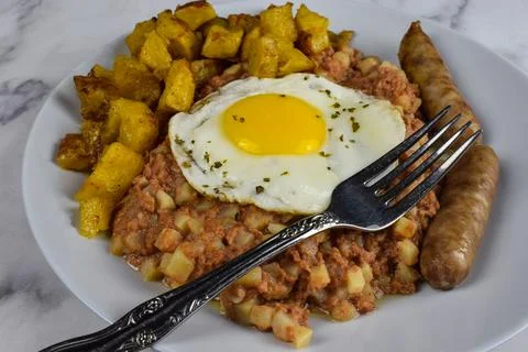 Corn beef hash with egg Stock Photos