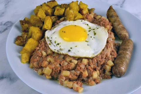 Corn beef hash with egg Stock Photos