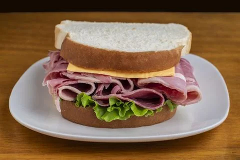 Corn beef top with cheese on white bread Stock Photos