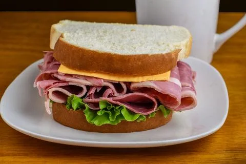 Corn beef top with cheese on white bread Stock Photos