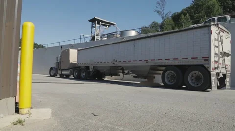 Corn being unloaded into a distillery for fermenting and making bourbon whiskey Stock Footage 59522971