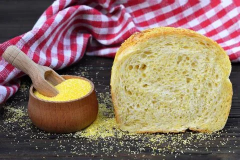Corn bread and corn flour on wooden background Stock Photos
