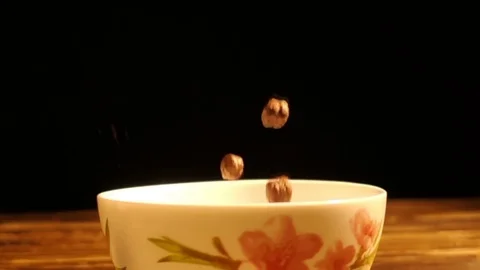 Corn breakfast cereals falling in a bowl, slow motion Stock Footage 83604669
