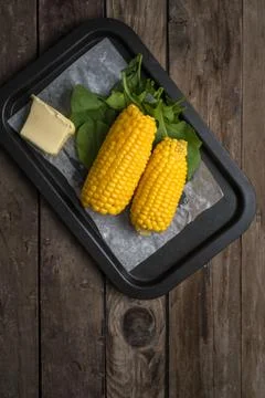 Corn with butter Stock Photos