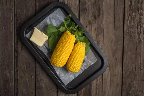 Corn with butter Stock Photos