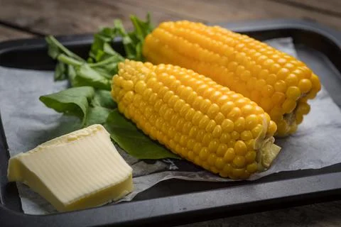Corn with butter Stock Photos