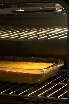 Corn cake in open oven Stock Photos