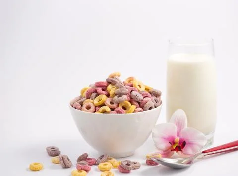 Corn cereal breakfast flake in children cups and milk is a healthy breakfast  Stock Photos