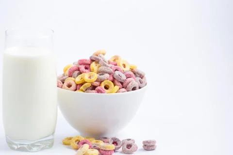 Corn cereal breakfast flake in children cups and milk is a healthy breakfast  Stock Photos
