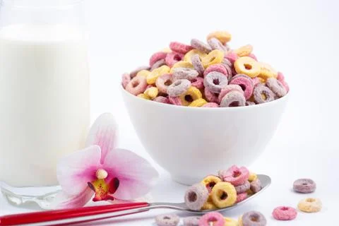 Corn cereal breakfast flake in children cups and milk is a healthy breakfast  Stock Photos