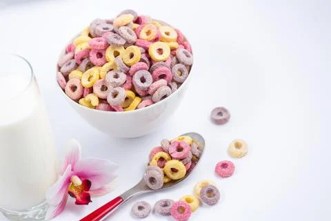 Corn cereal breakfast flake in children cups and milk is a healthy breakfast  Stock Photos