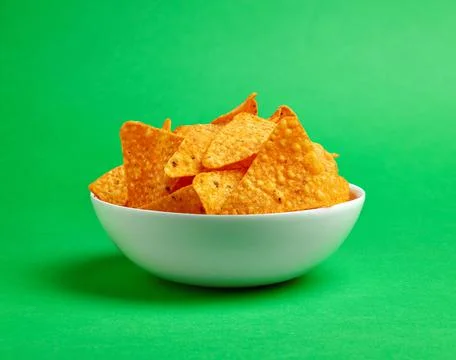 Corn chips nachos on green background Stock Photos