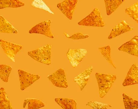 Corn chips nachos on orange background Stock Photos