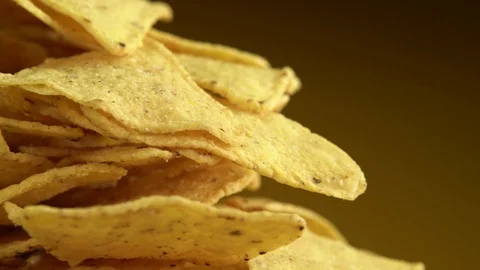 Corn chips rotate in front of the camera. Stock Footage 126403453