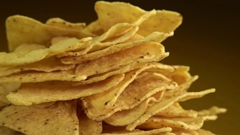 Corn chips rotate in front of the camera. Stock Footage 126403457