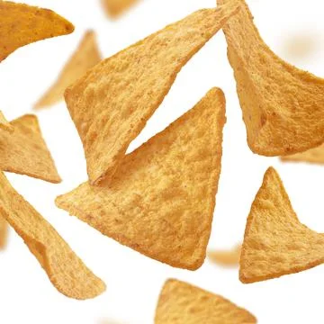 Corn chips of triangular shape levitate on a white background Stock Photos