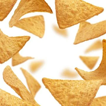 Corn chips of triangular shape levitate on a white background Corn chips o... Stock Photos