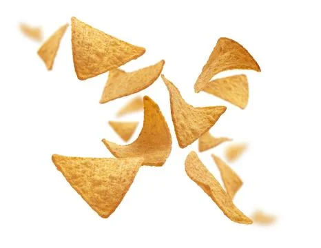 Corn chips of triangular shape levitate on a white background 스톡 사진