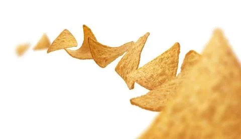 Corn chips of triangular shape levitate on a white background 스톡 사진
