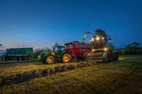 Corn chopper at night Claas Jaguar silage harvest Stock Photos