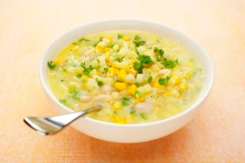 Corn chowder soup with potatoes and green capsicum Stock Photos