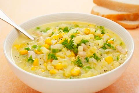 Corn chowder soup with potatoes and green capsicum Stock Photos