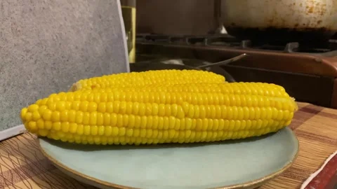 Corn cob in a blue bowl Stock Footage 315574936