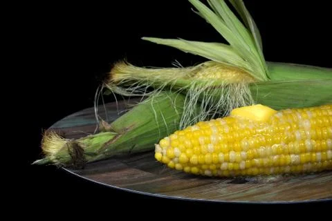 Corn on the cob with butter Stock Photos
