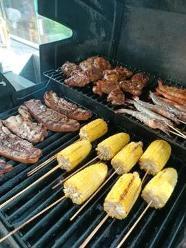 Corn cob pork barbeque poolside chicken Stock Photos