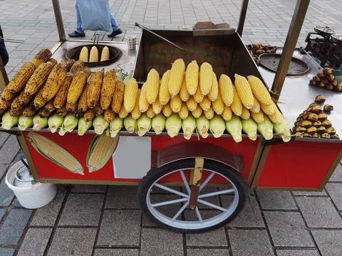 Corn on the cob roasted and grilled ready for sale Stock Photos