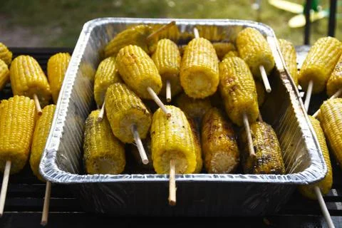 Corn on the cobs being grilled Stock Photos
