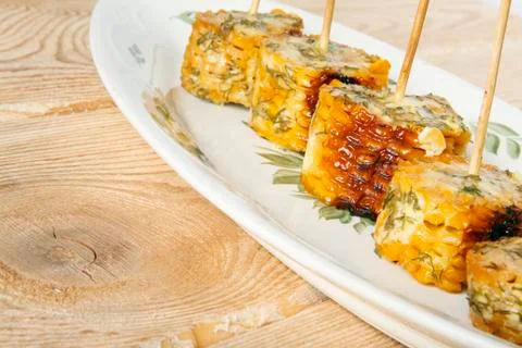 Corn cobs cooked on a grill Stock Photos