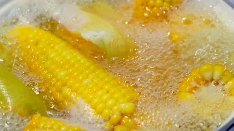 Corn is cooked in boiling water Stock Footage 137350025