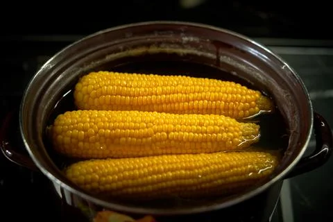 Corn is cooked in a pan in the kitchen, cafe Stock Photos