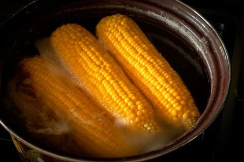 Corn is cooked in a pan in the kitchen, cafe Stock Photos