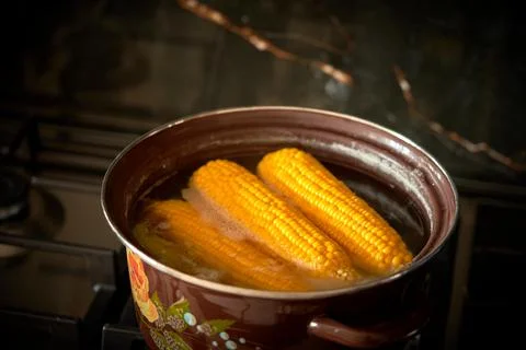 Corn is cooked in a pan in the kitchen Stock Photos