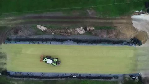 Corn crop, corn silage pile with tractor stuck Stock Footage 146061655