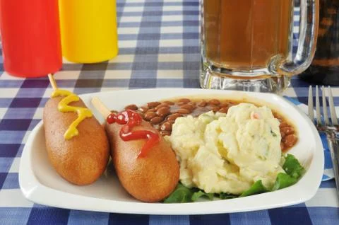 Corn dogs on a picnic table Stock Photos