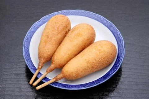 Corn dogs on a plate Stock Photos