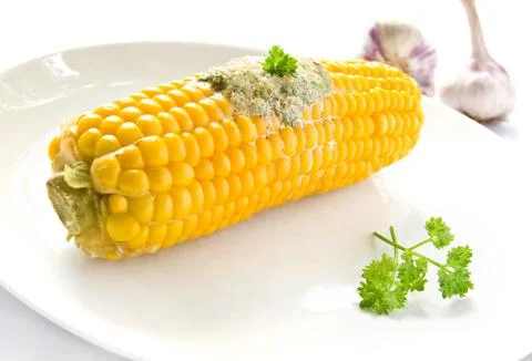 Corn ear with butter Stock Photos